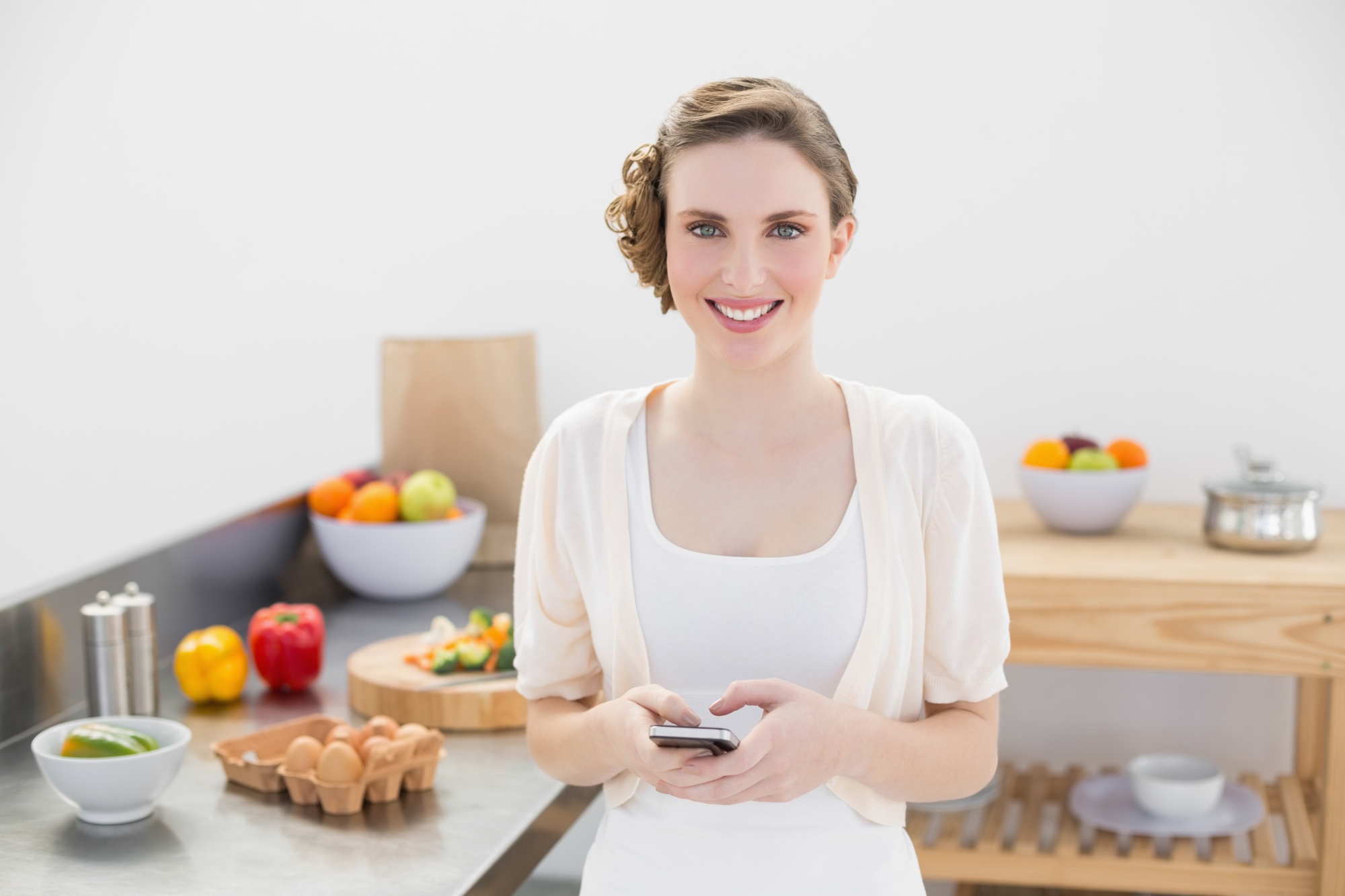 Student testimonial smiling in kitchen
